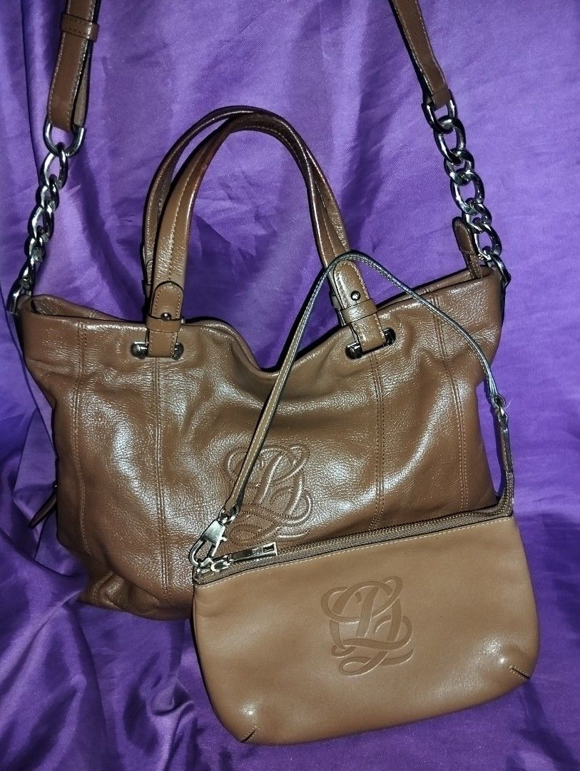 Louis Quatorze Brown Leather Bag (Category: Luxury Bags & Wallets) located in Caloocan City. Submitted by girlshopmcollection (Listing ID 1431121790, Image 1). Description: Handbag set includes a brown leather tote bag and a matching small pouch. The tote bag features a top handle and a detachable shoulder strap with chain accents. The pouch has a zipper closure and a wrist strap. Both items have the Louis Quatorze logo embossed on the front. The