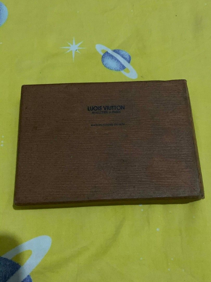 Louis Vuitton Key Holder (Category: Luxury Bags & Wallets) located in Manila. Submitted by yenglaloves04 (Listing ID 1431084509, Image 1). Description: - Authentic Louis Vuitton key holder - Dark green exterior with LV logo - Multiple key hooks - Secure snap closure - Comes with original box - Made in France.