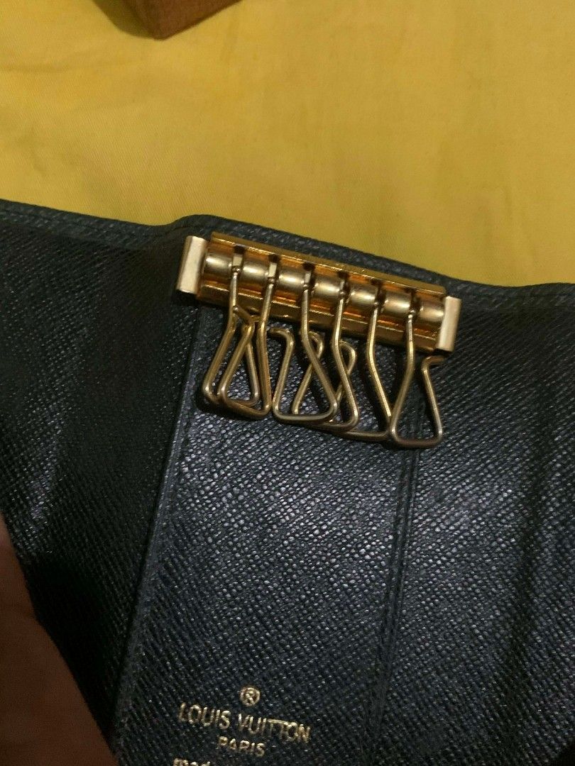 Louis Vuitton Key Holder (Category: Luxury Bags & Wallets) located in Manila. Submitted by yenglaloves04 (Listing ID 1431084509, Image 3). Description: - Authentic Louis Vuitton key holder - Dark green exterior with LV logo - Multiple key hooks - Secure snap closure - Comes with original box - Made in France.