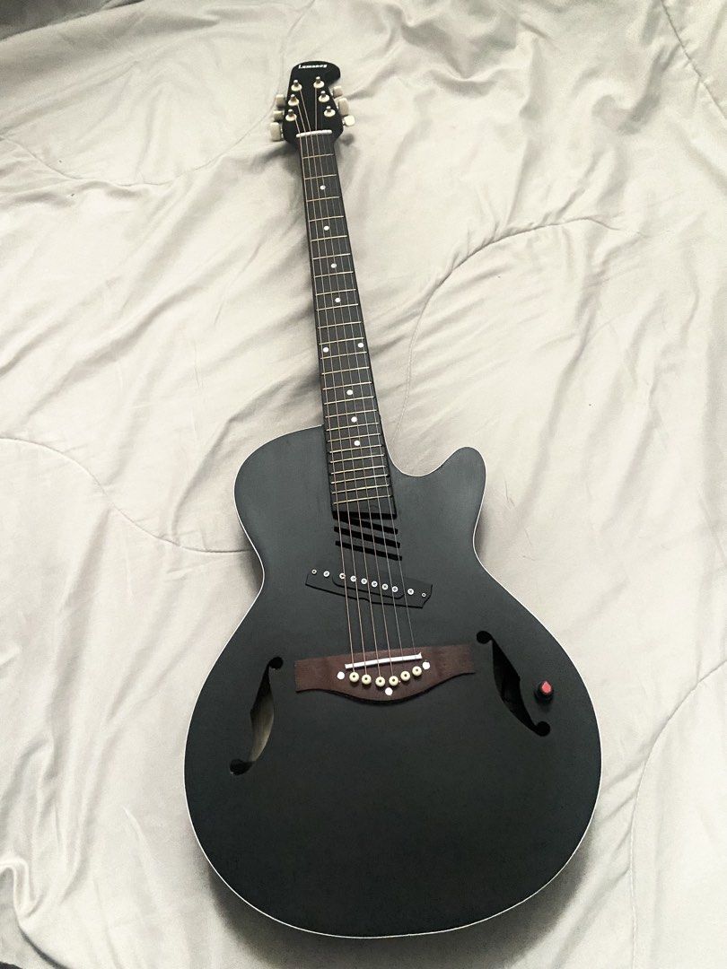 Lumanog Acoustic Electric Guitar (Category: Musical Instruments) located in Rizal. Submitted by stargirllll (Listing ID 1431061661, Image 2). Description: 41 inch, w/wires, bag, capo.