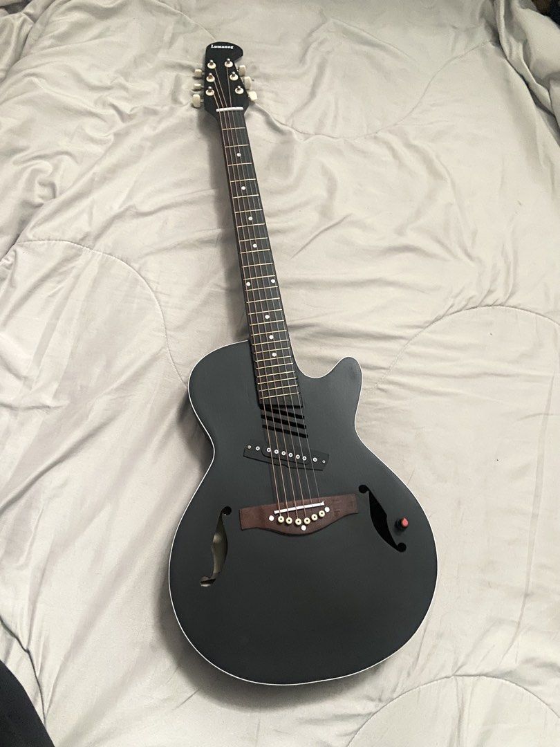 Lumanog Acoustic Electric Guitar (Category: Musical Instruments) located in Rizal. Submitted by stargirllll (Listing ID 1431061661, Image 1). Description: 41 inch, w/wires, bag, capo.