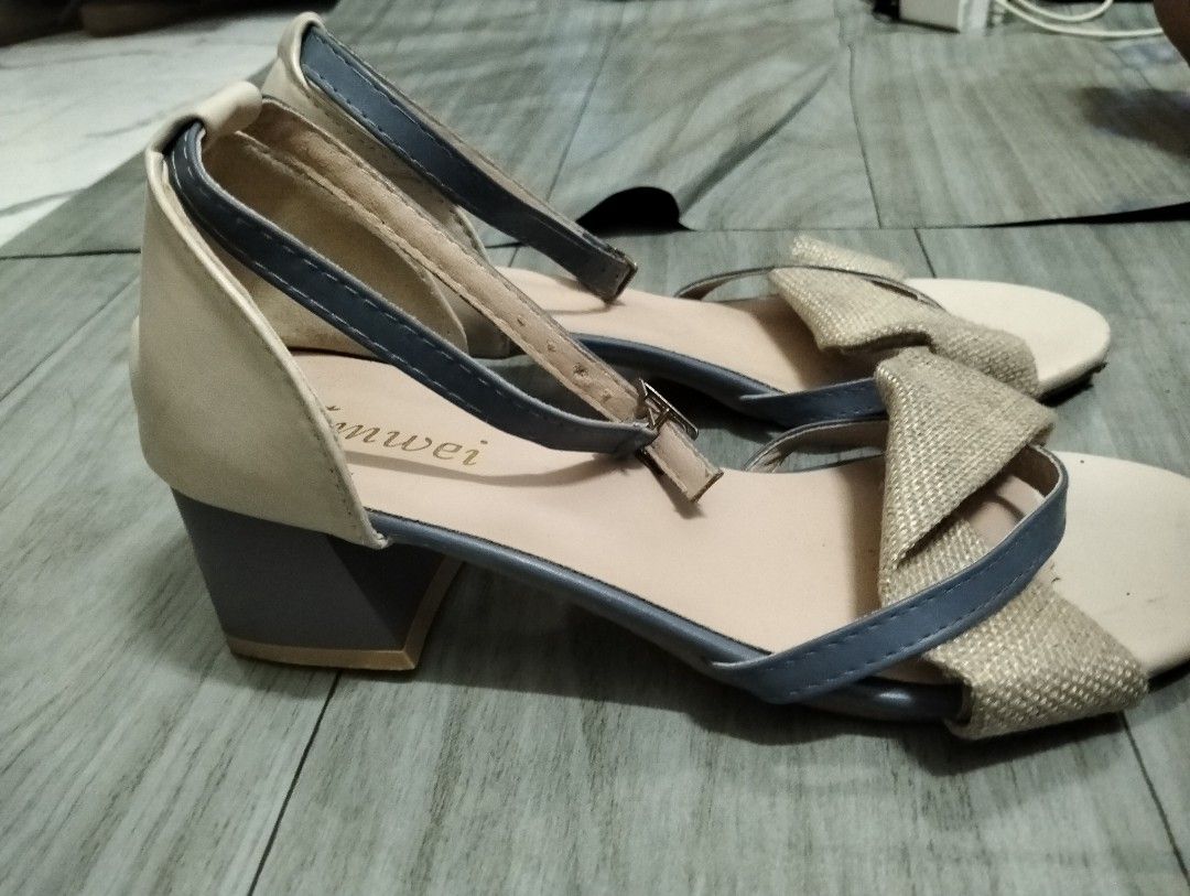 Lumei Beige and Blue Sandals (Category: Flats & Sandals) located in Gasan. Submitted by AngeliqueKaye (Listing ID 1431090803, Image 2). Description: Used once only.Elegant sandals featuring a beige and blue color scheme. The sandals have a strap around the ankle and a bow detail on the front. The brand name "Lumei" is visible on the insole. They have a small block heel for added comfort and style. Perfect for a casual or semi-formal look..
