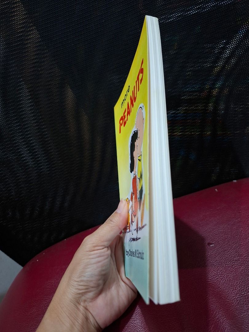 More Peanuts by Charles M. Schulz (Category: Comics & Manga) located in Pasig City. Submitted by loisegems (Listing ID 1430981211, Image 2). Description: Book features the comic strip "More Peanuts" by Charles M. Schulz. The cover shows Charlie Brown, Lucy, and a toy duck. The book contains black and white comic strips. It's a great item for Peanuts fans..