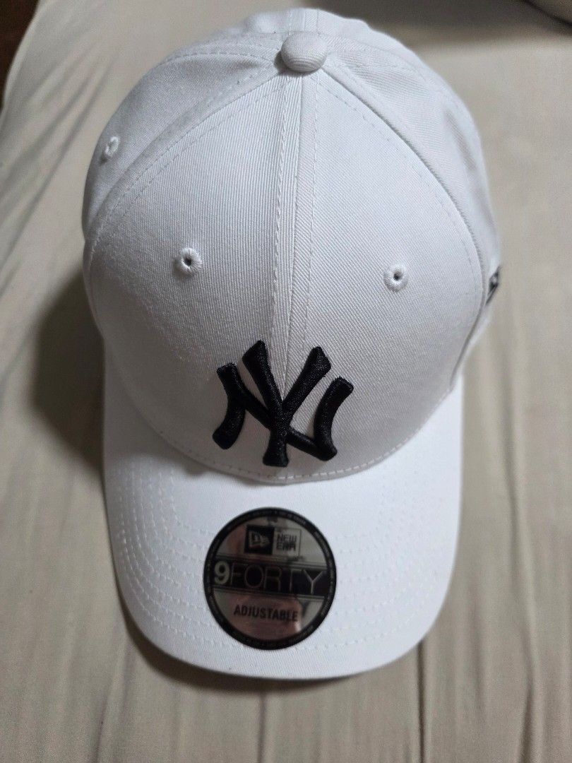 New Era 9FORTY Adjustable Cap - White (Category: Caps & Hats) located in Quezon City. Submitted by yGGGG (Listing ID 1431024043, Image 2). Description: Brandnew White New Era 9FORTY cap with the New York Yankees logo. Features an adjustable strap at the back for a comfortable fit. Includes the official New Era sticker. The cap has the MLB logo inside. Made with quality materials for durability and style..