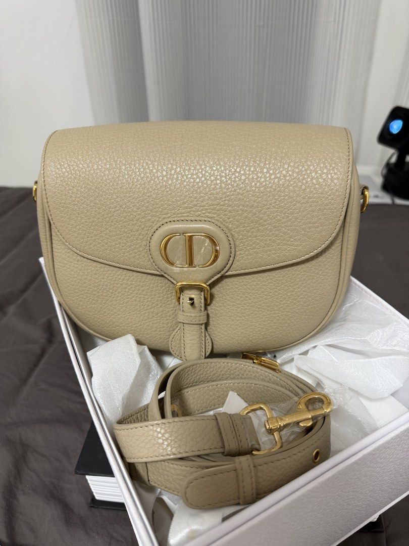 Onhand Dior CD Bobby Medium in Grained Beige Calfskin (Category: Luxury Bags & Wallets) located in Taguig. Submitted by lulevitabags (Listing ID 1430403008, Image 1). Description: Good condition ❤️ Bag and Strap only Can free Legit grails.
