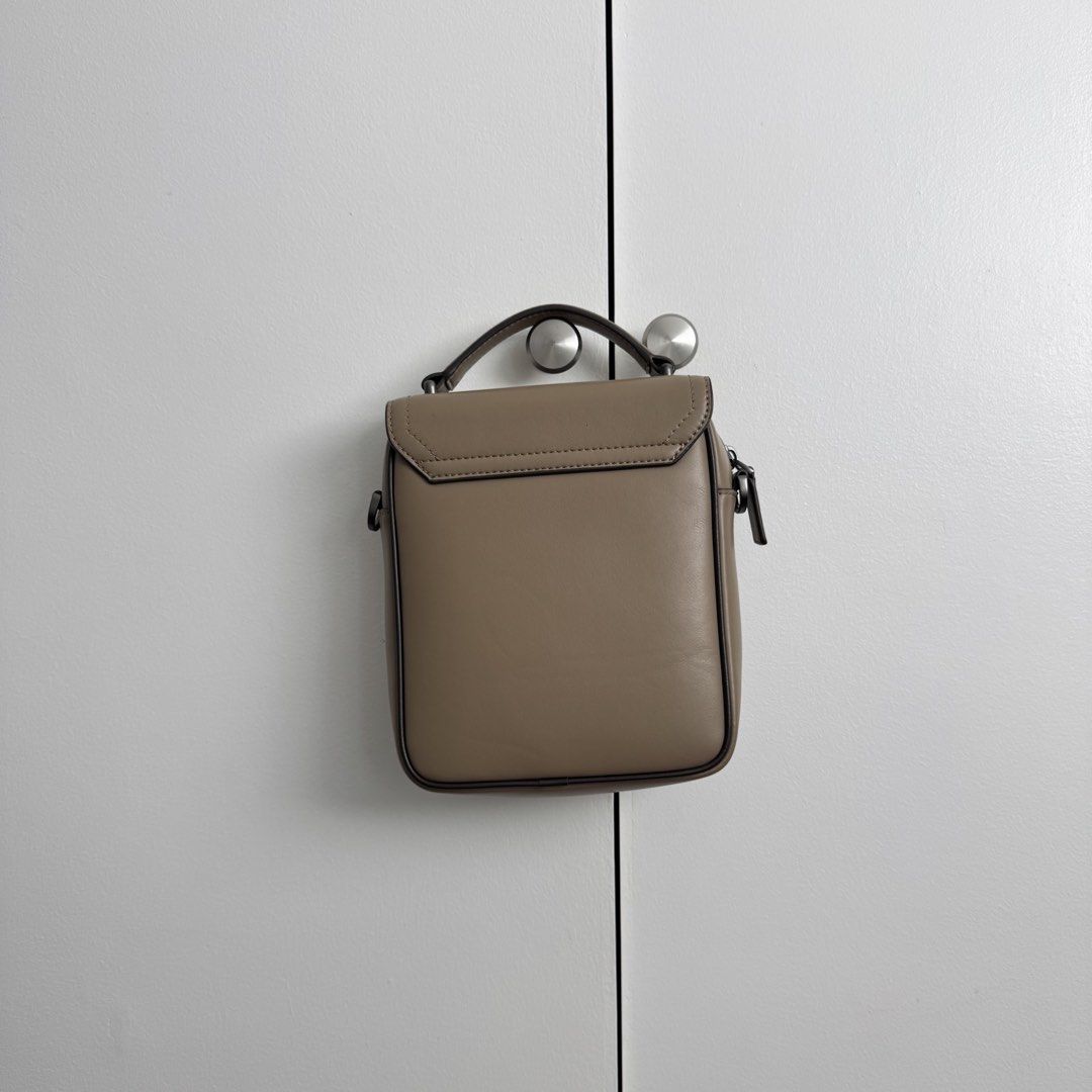 PEDRO Letterman Bag Trendy Beautiful (Category: Cross-body Bags) located in Pasig City. Submitted by cruelsummer69 (Listing ID 1431050306, Image 2). Description: Pedro sling bag features a flap closure and a top handle. It has a main compartment with a zipper closure and an adjustable strap. The bag is in a neutral color and has a textured front panel. It also has a small pocket on the front. The bag is suitable for everyday use..