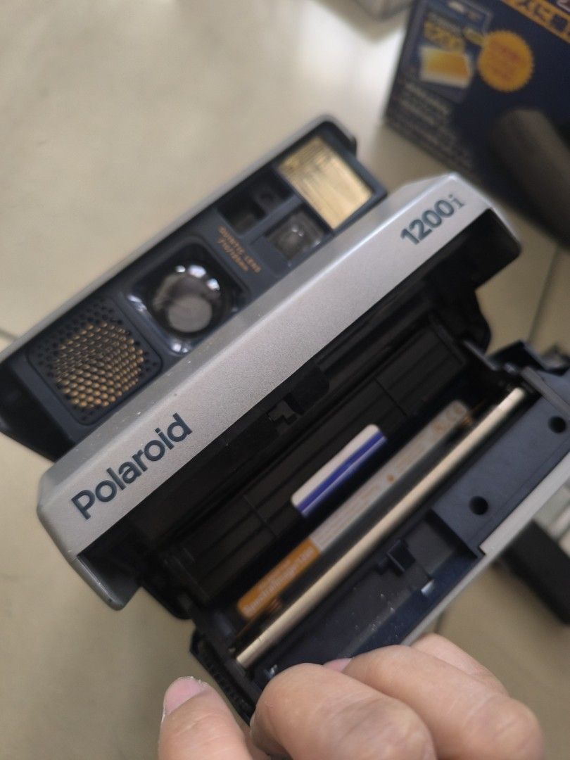 Polaroid 1200i instant camera vintage old (Category: Cameras) located in Manila. Submitted by lianlim.mail (Listing ID 1430993040, Image 2). Description: Polaroid 1200i Japan. Vintage instant camera. missing hand strap. but has beck strap. Woth box akd manual. untested because no film. As Is .