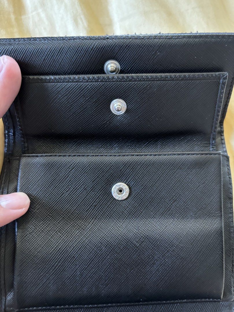 Prada Nylon Wallet (Category: Luxury Bags & Wallets) located in Los Banos. Submitted by declutterlistt (Listing ID 1430998414, Image 3). Description: Selling my old vintage Prada Tessuto nylon wallet - black - no inclusions - been in my closet for 2 years already - card, coins, cash compartment 1200 FREE SHIPPING.