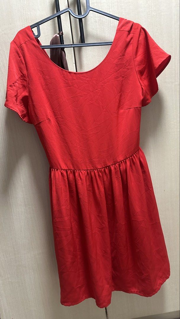 Sexy Red Dress with Open Back (Category: Dresses) located in Valenzuela. Submitted by jam0816 (Listing ID 1431172638, Image 2). Description: - Red dress - Scoop neckline - Short sleeves - Fitted bodice with flared skirt - Open back with tie detail - Suitable for casual and special occasions.