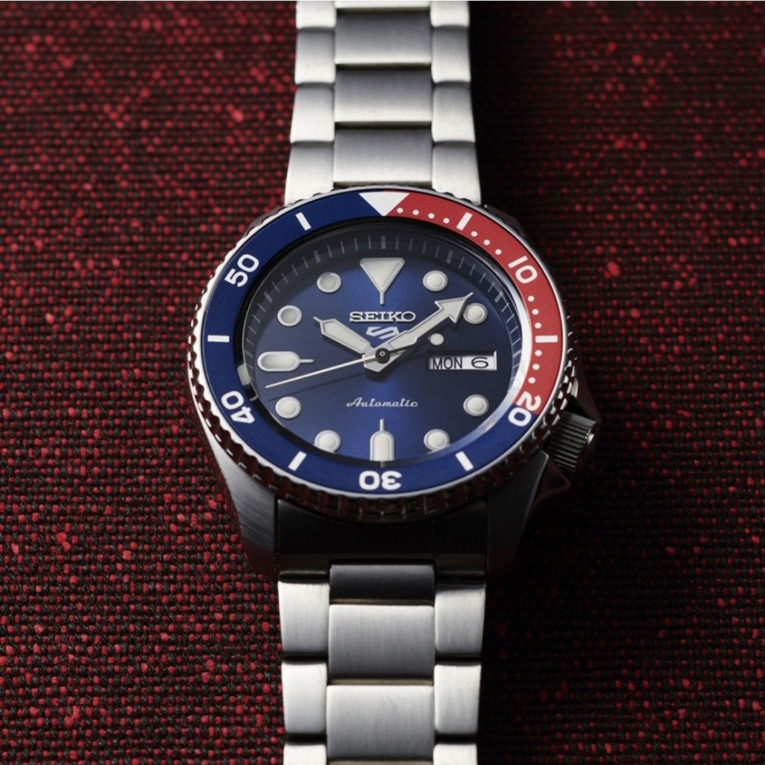 Seiko 5 Sports SBSA003 Automatic Watch (Category: Men's Watches) located in Mandaluyong City. Submitted by bernartem (Listing ID 1430990332, Image 2). Description: Brand new Original and authentic With 3-year warranty Blue and red "Pepsi" style bezel Stainless steel bracelet Automatic Caliber 4R36 with manual winding capability Water Resistance: 10 bar (100 meters/330 feet) Features: day/date display, rotating bezel, and luminous hands and marker