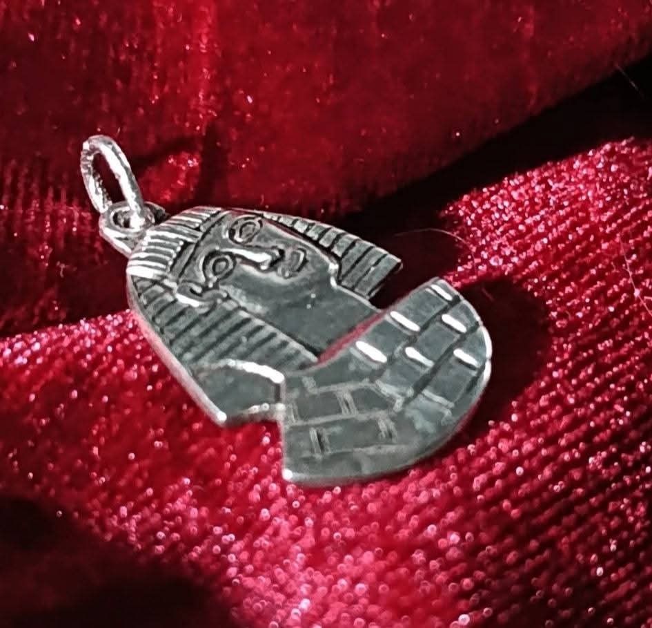 Silver Egyptian Pharaoh Pendant (Category: Charms) located in Gingoog City. Submitted by ThePurpleBox (Listing ID 1431076986, Image 3). Description: Pure Egyptian Revival—perfect for the collector who values history and mystery. 1,850php✅ This King Tutankhamun pendant is a tribute to the "Golden Boy," featuring the classic Nemes headdress resting atop an etched stepped pyramid. Metal: Sterling Silver with a deep, oxidized patina Size: 25mm H incl