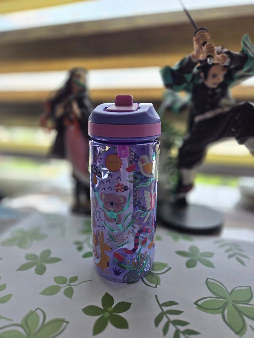 Smiggle Water Bottle - Various Designs (Category: Water Bottles & Tumblers) located in Taytay. Submitted by smiggleavenue (Listing ID 1431022652, Image 2). Description: Smiggle water bottles in various colors and designs. Features a flip-top lid and a clear body with decorative elements. Available in pink, purple, blue, and green. BPA-free. Perfect for staying hydrated on the go. Each bottle has a unique design with different patterns and colors.