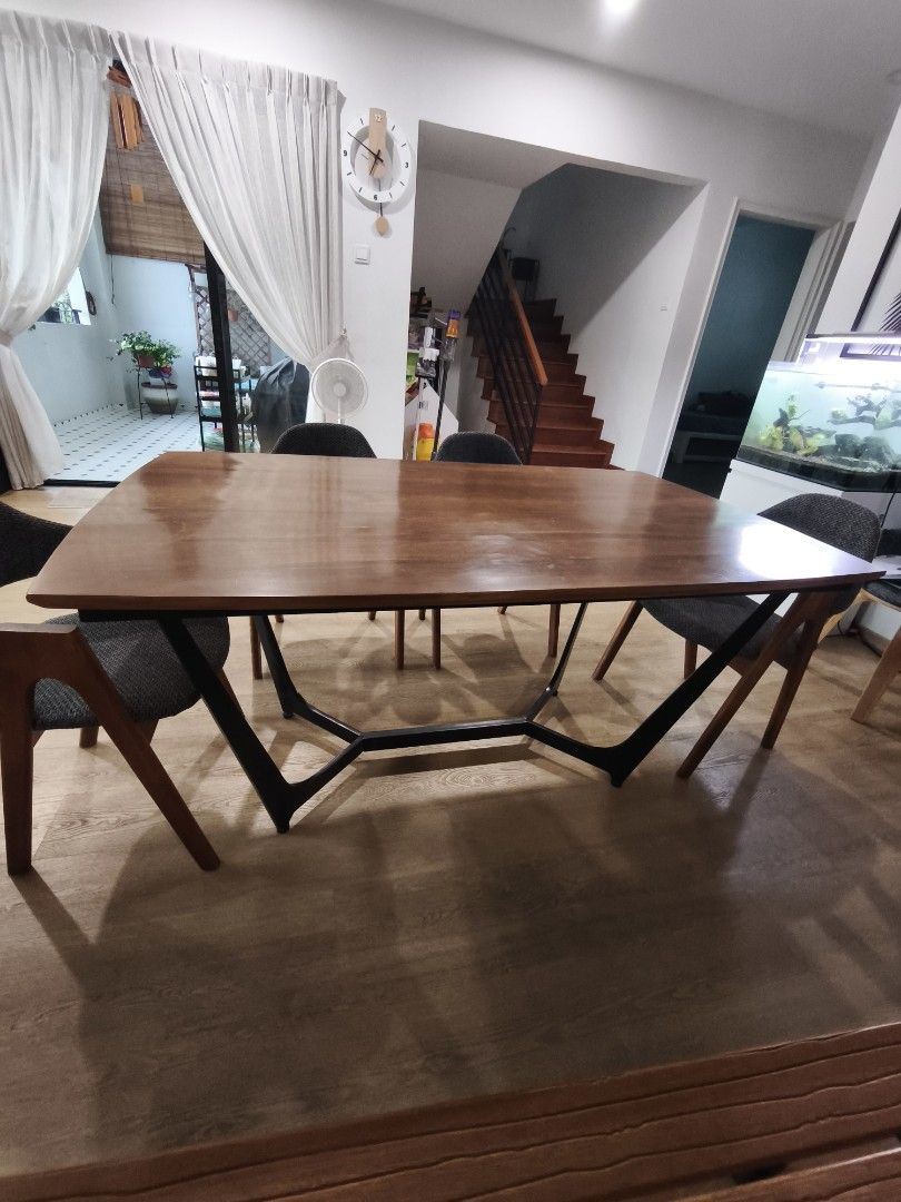 Solid wood dining table (table only) (Category: Tables & Sets) located in Singapore. Submitted by ccing_12 (Listing ID 1430983735, Image 2). Description: Well used dining table with solid wood table top and sturdy metal leg. need to clear from house asap as have purchased new table. 1.5mx0.9mx0.76m Arrange own pickup please..