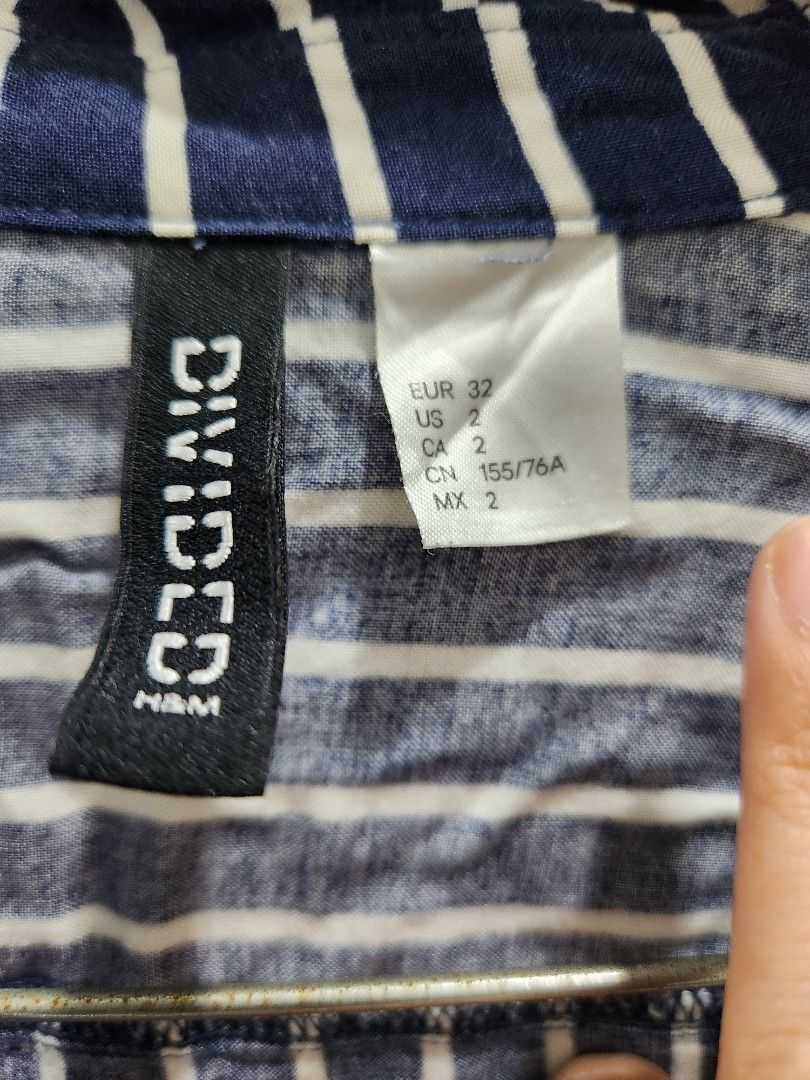 H&M Striped Long Sleeve Shirt (Category: Longsleeves) located in Quezon City. Submitted by mlcl62336 (Listing ID 1431021253, Image 2). Description: Navy blue and white striped long sleeve shirt. extra button intact.