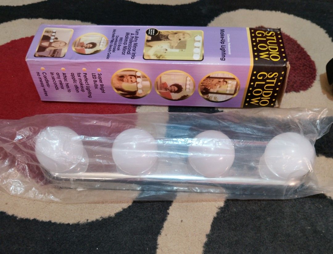Studio Glow Makeup Mirror Light (Category: Makeup) located in Manila. Submitted by boyhet.thrift15 (Listing ID 1431099191, Image 3). Description: Studio Glow makeup lighting. Turns any mirror into a professional makeup mirror. Includes manuals Installs in seconds with powerful suction cups. Attaches to any mirror. LED bulbs for perfect lighting. Includes an on/off switch. required 4pcs AA selling 400.