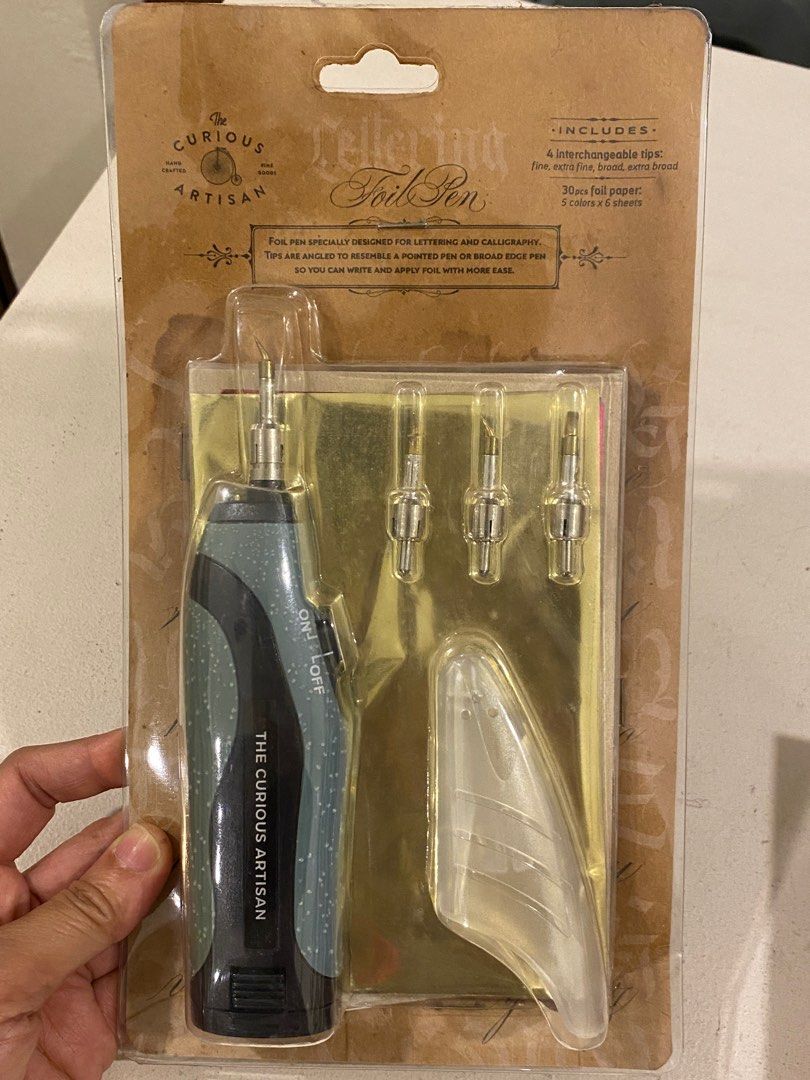 The Curious Artisan Lettering Foil Pen Set (Category: Stationery & School Supplies) located in Davao. Submitted by iam_artisan (Listing ID 1431096371, Image 3). Description: Old stock but brand new. Can be used on any surfaces. Portable and battery operated. Kit comes with foil sheets. .