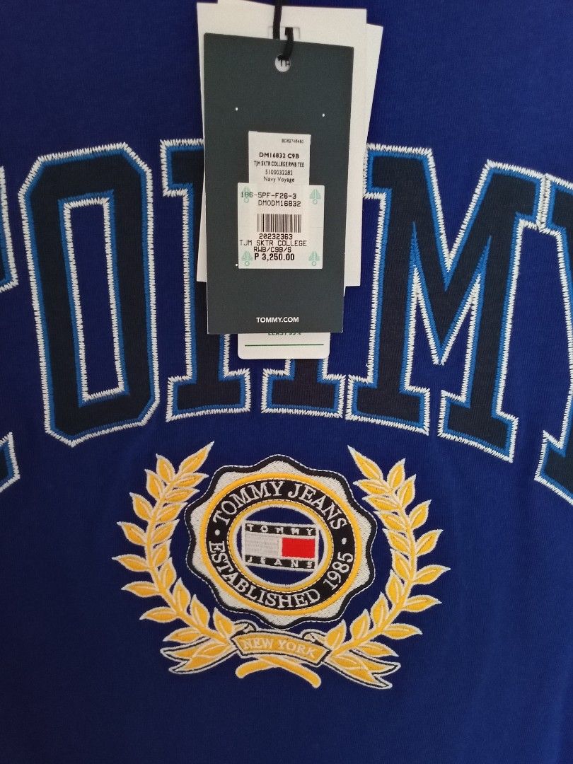 Tommy Jeans Blue Graphic Tee - Size S (Category: Tshirts & Polo Shirts ) located in Imus. Submitted by dey.ore (Listing ID 1431065358, Image 2). Description: - Authentic Tommy Jeans t-shirt - Color: Blue - Size: S - Design: Large "TOMMY" graphic with laurel wreath - Made in Bangladesh - Brand new with original price tag - Original Price: ₱3,260.00.