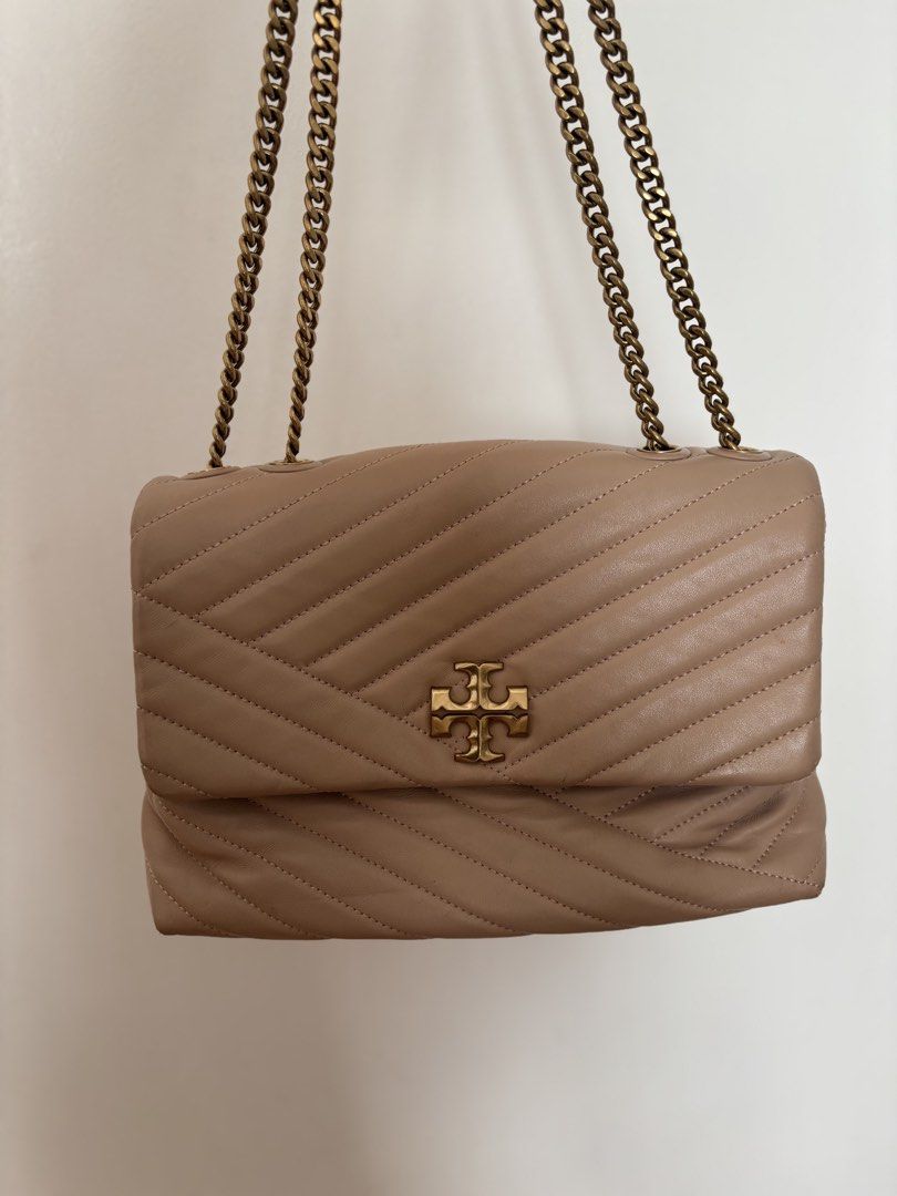 Tory Burch Kira Chevron Shoulder Bag (Category: Luxury Bags & Wallets) located in Manila. Submitted by curtsysprettythings (Listing ID 1431040746, Image 1). Description: Some flaws indicated on the photos Creases and pen mark Used less than 5 times, creases came from closet storage 100% authentic .
