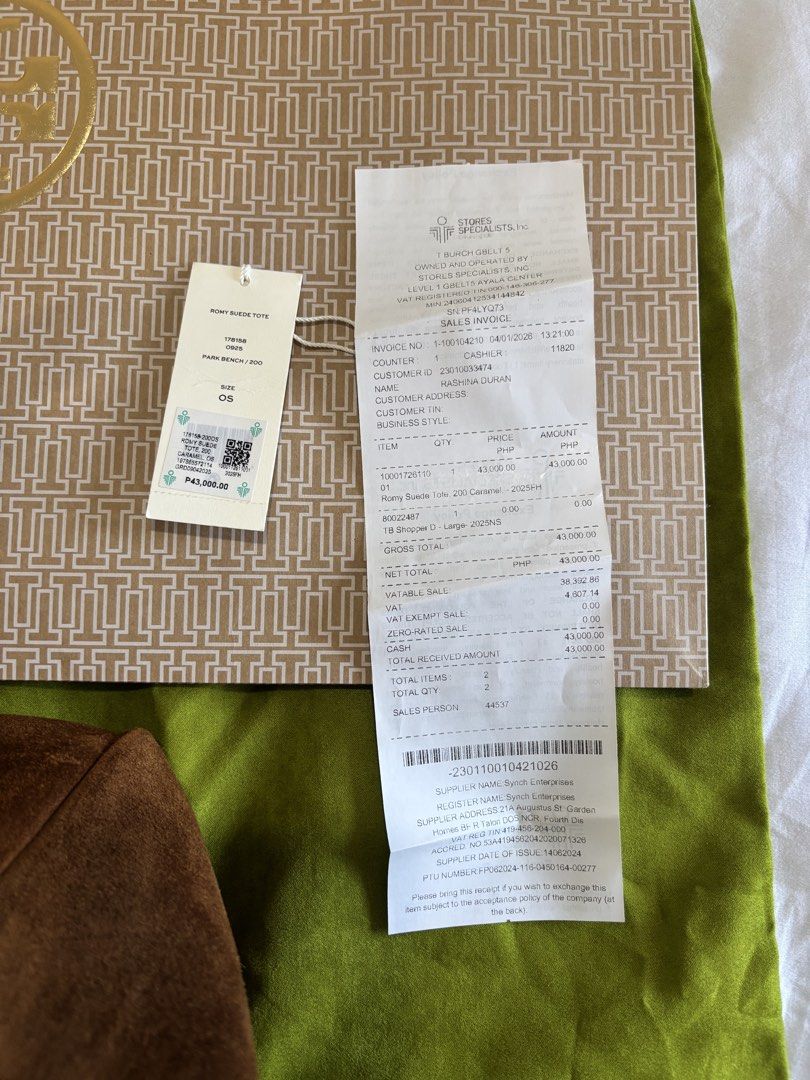 Tory Burch Suede Romy Tote (Category: Luxury Bags & Wallets) located in Cabatuan. Submitted by fiercedolphin_3b4207 (Listing ID 1431031492, Image 3). Description: - Authentic Tory Burch suede tote bag - Brown suede exterior with leather straps - Includes dust bag and original receipt - Features an interior pocket - Original price tag included - Unused condition.