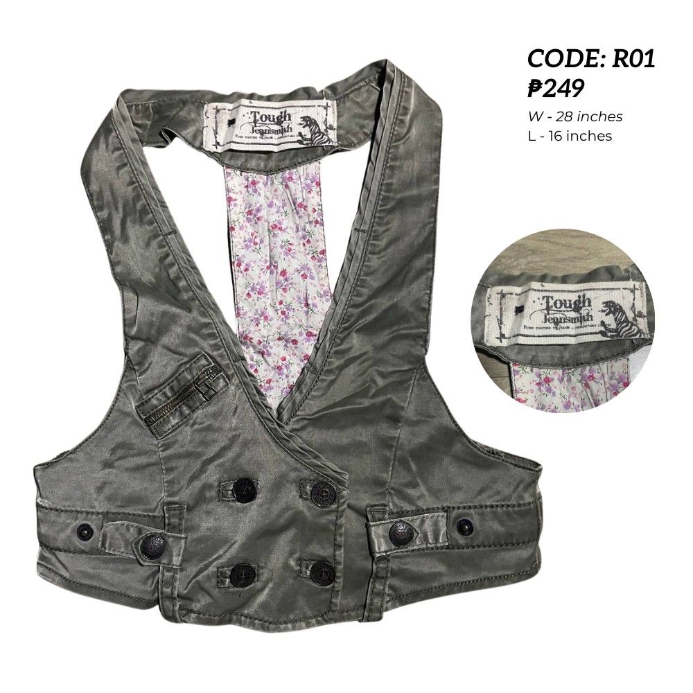 Tough Jeansmith Green Vest (Category: Others Tops) located in Manila. Submitted by rackofyuu (Listing ID 1427308792, Image 1). Description: Measurements: W - 28 inches L - 16 inches MOP: GCash Stylish vest from Tough Jeansmith. Features a unique design, a double-breasted front with buttons. Includes two front pockets and a small zippered pocket. The vest has a halter-style neckline. The color is a muted olive green. Perfect for layering..