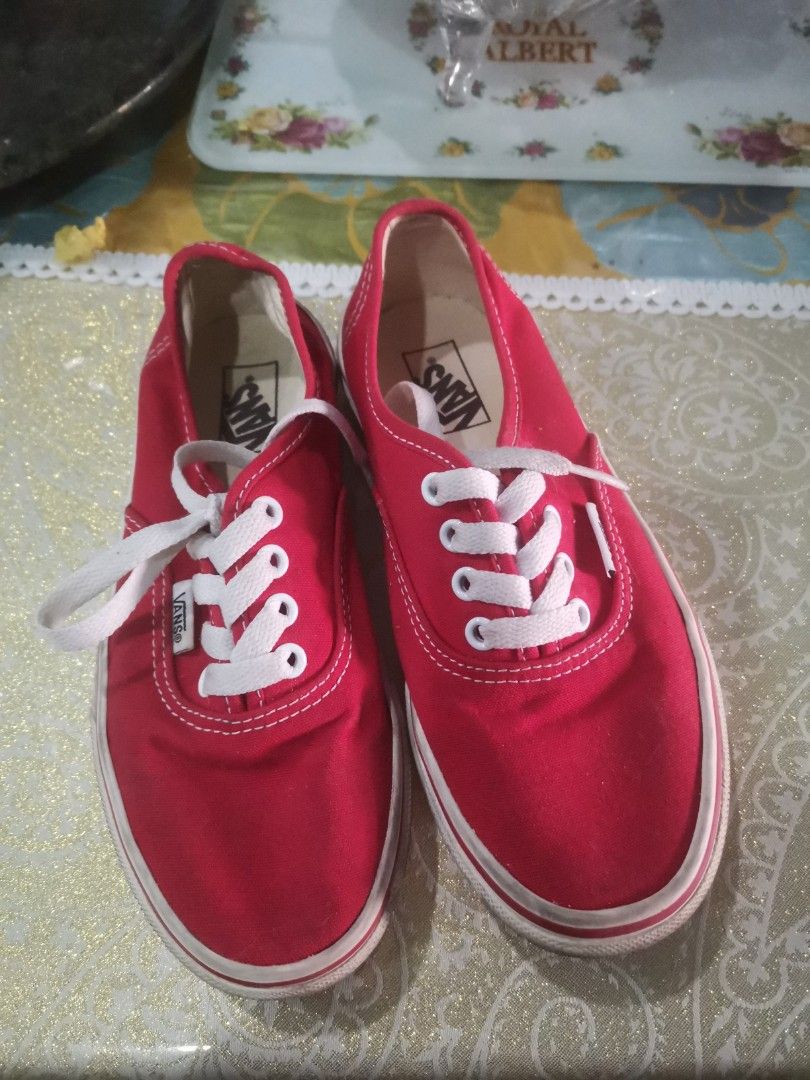 Vans Authentic Red Sneakers for kids 21cm (Category: Sneakers) located in Paranaque City. Submitted by francismichaelwalrath2-28680 (Listing ID 1430984658, Image 1). Description: Classic red Vans Authentic sneakers. Features white laces and a white sole. The Vans logo is visible on the tongue and insole. The soles show some wear. A timeless design perfect for everyday wear..