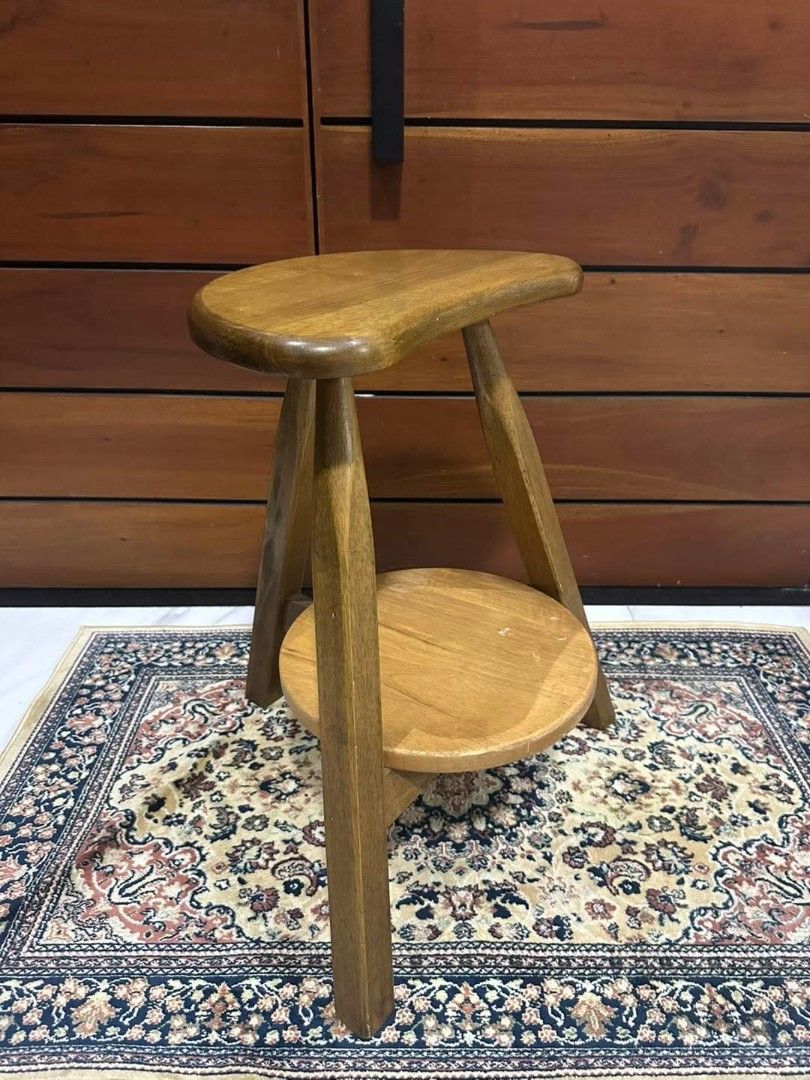 Vintage 3-legged Crescent-shape Stool Chair (Category: Chairs) located in Quezon City. Submitted by dannikkishoppe2 (Listing ID 1431010747, Image 3). Description: Vintage 3-legged Crescent-shape Stool Chair‼️₱2800‼️ *with lower round shelf *can be used as a side table *vintage *heavy wood These are SURPLUS items and not BRAND NEW. Please manage your expectations as there might be minimal flaws. Color may vary due to lighting, it may appear darker