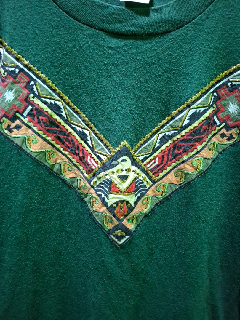 Vintage Green Aztec Patterned Detail - Large (Category: Coats, Jackets and Outerwear) located in Manila. Submitted by darth3pter (Listing ID 1431113983, Image 3). Description: Green Jerzees sweatshirt with patterned detail on the chest and sleeves. Features a crew neck and long sleeves. The tag indicates a size Large. Made in the USA. Actual dimes: 21.5x27 Lrg 1,1,2 Stitching 🚫 Issue.