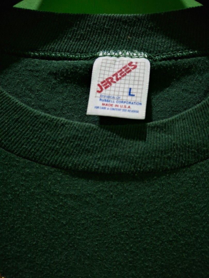 Vintage Green Aztec Patterned Detail - Large (Category: Coats, Jackets and Outerwear) located in Manila. Submitted by darth3pter (Listing ID 1431113983, Image 2). Description: Green Jerzees sweatshirt with patterned detail on the chest and sleeves. Features a crew neck and long sleeves. The tag indicates a size Large. Made in the USA. Actual dimes: 21.5x27 Lrg 1,1,2 Stitching 🚫 Issue.