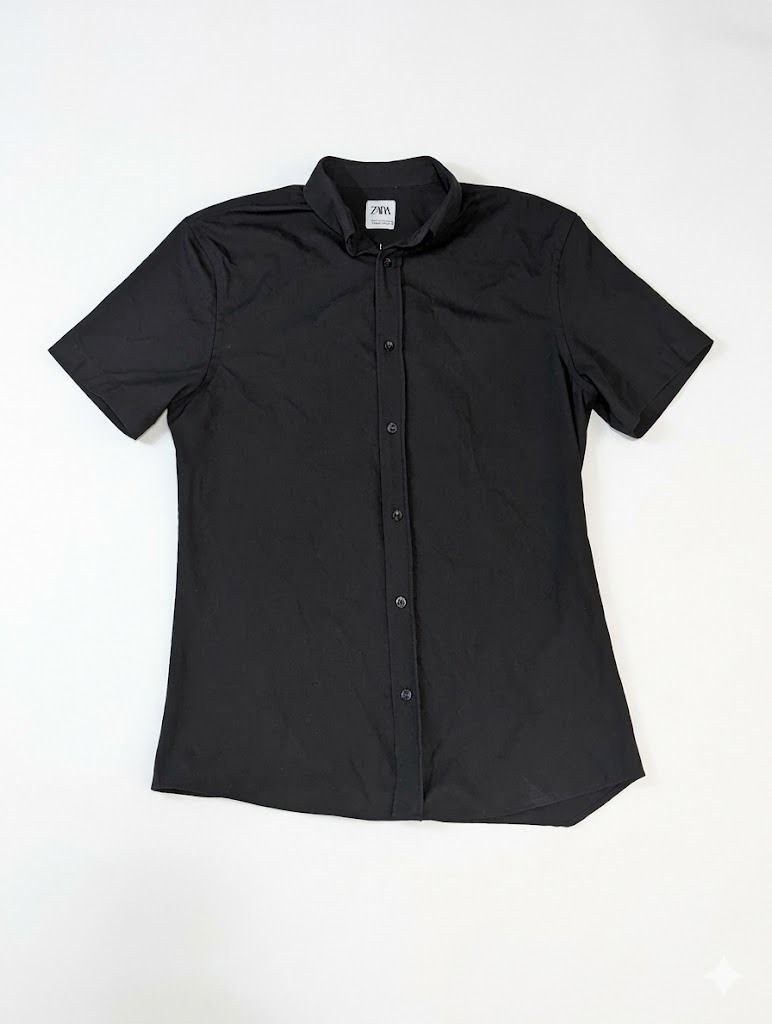 Zara Black Short Sleeve Button Down (Category: Shirts) located in Manila. Submitted by fromsiah (Listing ID 1430989945, Image 1). Description: Pre-owned ZARA BLACK COTTON BUTTON DOWN SIZE: Small on tag DIMENSIONS: Width - 20in Length - 28.5in CONDITION: 9.5/10 Color may vary due to lighting.