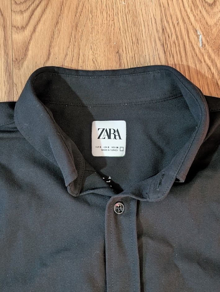 Zara Black Short Sleeve Button Down (Category: Shirts) located in Manila. Submitted by fromsiah (Listing ID 1430989945, Image 3). Description: Pre-owned ZARA BLACK COTTON BUTTON DOWN SIZE: Small on tag DIMENSIONS: Width - 20in Length - 28.5in CONDITION: 9.5/10 Color may vary due to lighting.
