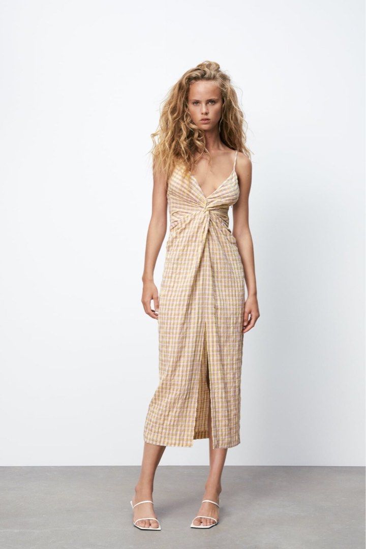 Zara checkered midi dress with front slit (Category: Dresses) located in Malabon City. Submitted by decluttergyal (Listing ID 1431110682, Image 1). Description: Size XS on tag, I’m an S and it still fits. However, since my bust grew in size it’s no longer comfortable to wear 🥲 Has fluffs which is unavoidable given the fabric (see image) Super flattering when worn even if you have small 🍒 Perfect for for strolling around, fabric doesn’t need iro