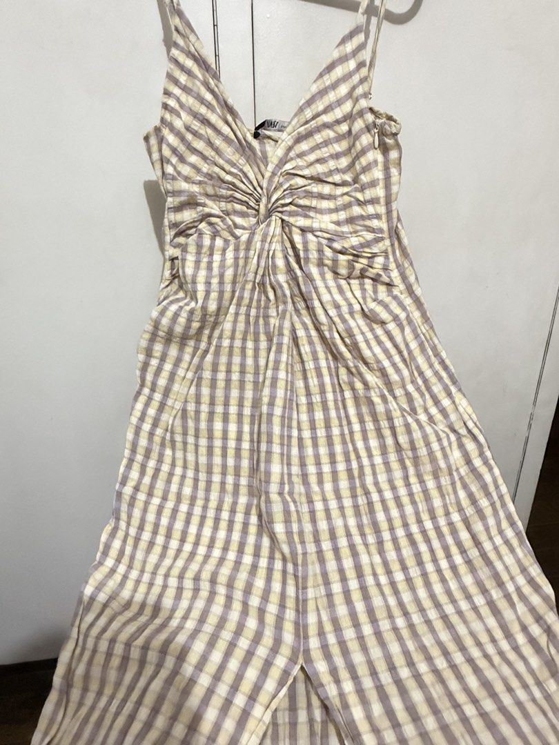 Zara checkered midi dress with front slit (Category: Dresses) located in Malabon City. Submitted by decluttergyal (Listing ID 1431110682, Image 3). Description: Size XS on tag, I’m an S and it still fits. However, since my bust grew in size it’s no longer comfortable to wear 🥲 Has fluffs which is unavoidable given the fabric (see image) Super flattering when worn even if you have small 🍒 Perfect for for strolling around, fabric doesn’t need iro