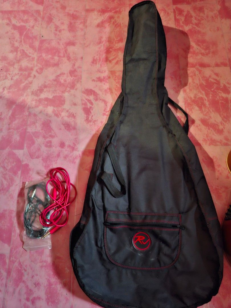 Acoustic-Electric Guitar with Case (Category: Musical Instruments) located in Manila. Submitted by grandgem-2085 (Listing ID 1435432689, Image 3). Description: -Bought 2023 Php 8000 -Good as new but with minimal scratch at the back - Acoustic-electric guitar with sunburst finish - Includes a black carrying bag - Comes with cable - Equipped with an onboard tuner for convenient tuning - Built-in preamp for amplified sound - Guitar has a logo on the