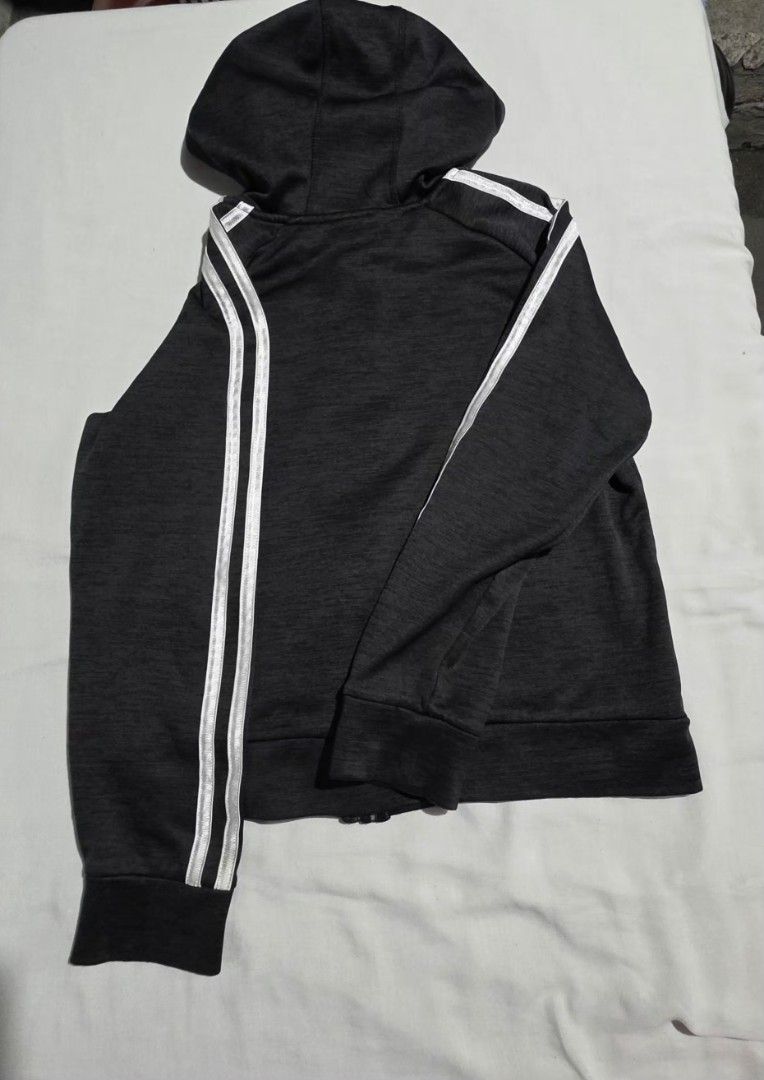 Adidas Hoodie with Stripes (Category: Hoodies) located in Pasig City. Submitted by budolresponsibly (Listing ID 1435446323, Image 2). Description: - Adidas full-zip hoodie - Dark grey color - Adidas logo on chest - Three white stripes on sleeves - Hooded - Two front pockets - Ribbed cuffs and hem - Comfortable for everyday wear -4/5T.