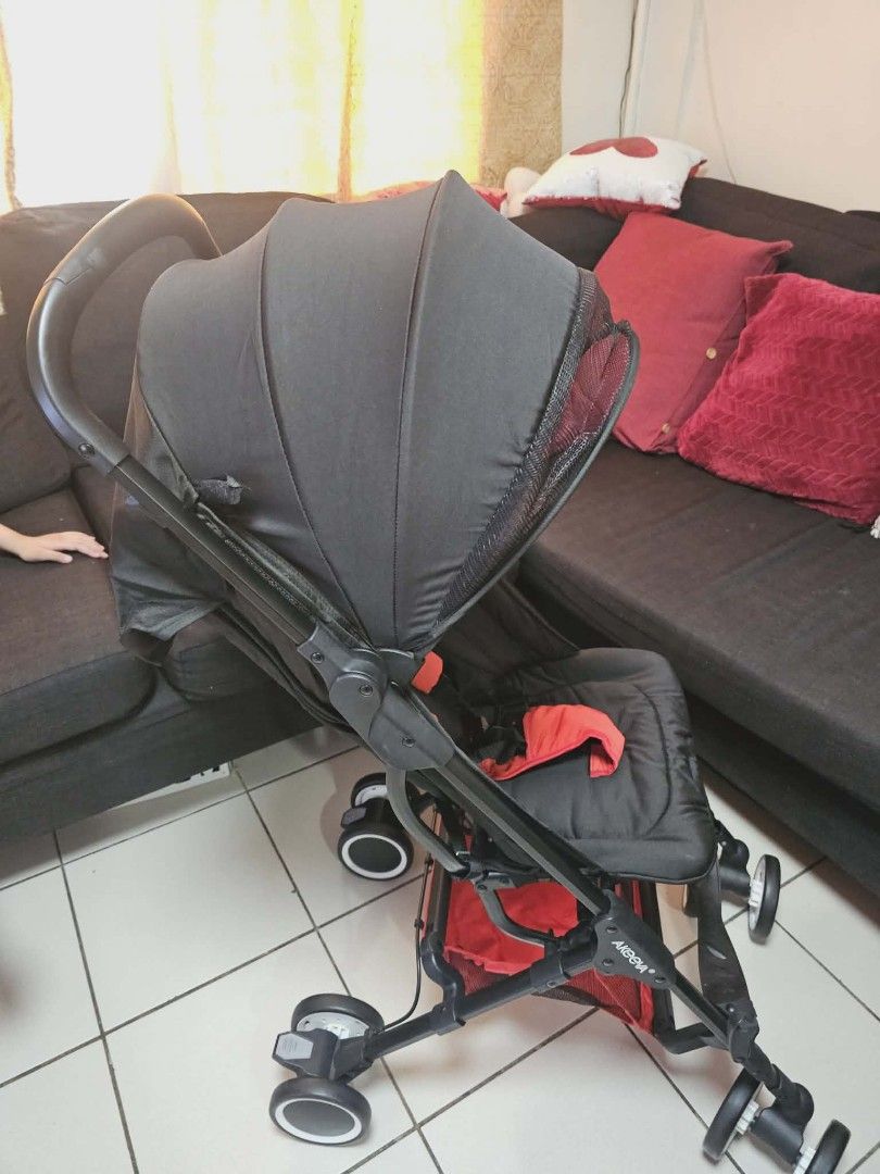 Akeeve Foldable Stroller with Carry Bag (P-Loved) (Category: Strollers) located in Mandaluyong City. Submitted by alithereluckytrading (Listing ID 1435363682, Image 1). Description: Black frame with bright red accents. Ultra-compact, one-hand self-fold. Cabin-size compatible for air travel. Includes: 5-point harness and AKEEVE travel carry bag. Condition: P-loved, in good working condition. Fully functional fold mechanism. Frame and wheels show n