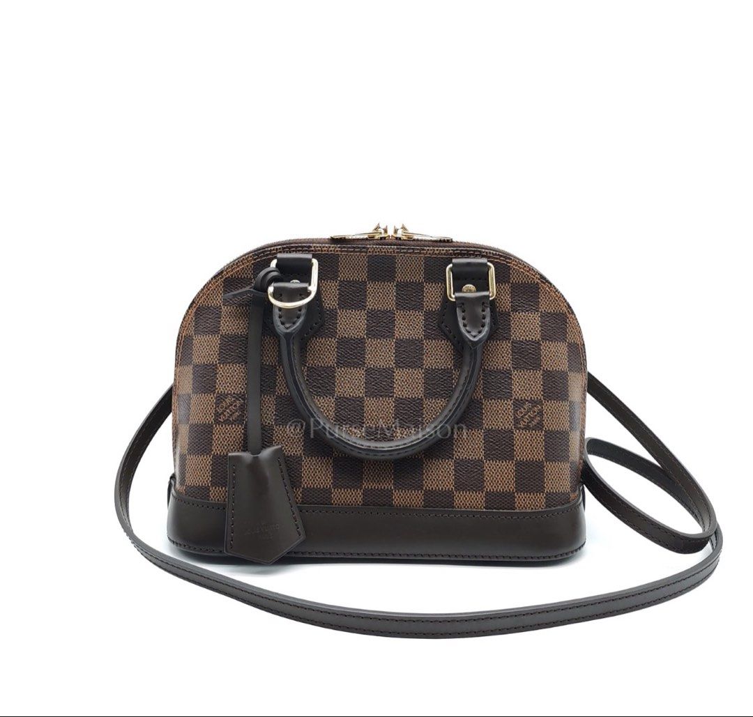Alma BB in Damier Ebene Canvas Shoulder Bag (Date Code: AR3189) (Category: Luxury Bags & Wallets) located in Taguig. Submitted by pursemaison (Listing ID 1435433134, Image 1). Description: Alma BB in Damier Ebene Canvas Shoulder Bag (Date Code: AR3189) Price: Php 96,800.00 Condition: Very Good (8.5/10) Exterior: Moderate signs of usage, marks on the bottom leather trim, minor creasing, signs of usage & scuffs on handles, marks on clochette Interi