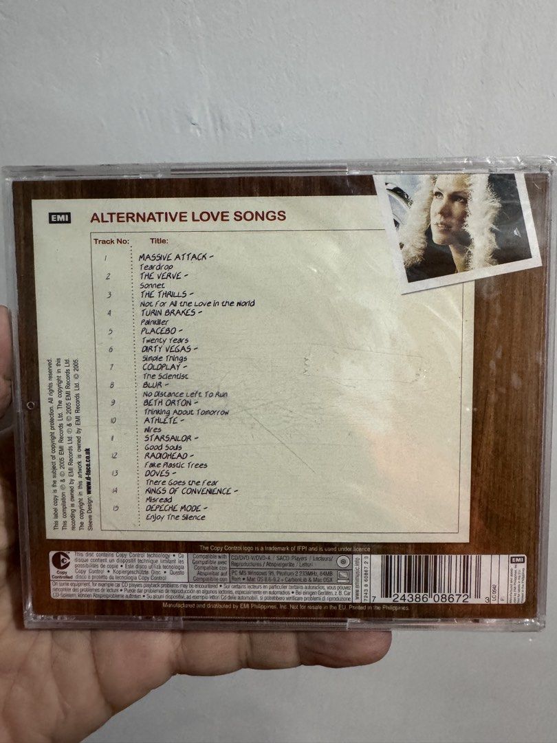 Alternative Love Songs CD (Category: CDs & DVDs) located in San Juan City. Submitted by redgecollection (Listing ID 1435374809, Image 2). Description: Sealed - Alternative Love Songs CD - Featuring artists: Massive Attack, Blur, Radiohead, and more - Tracklist includes: "Teardrop", "Song 2", "No Distance Left to Run" - Compilation of alternative love songs - CD case visible in images.