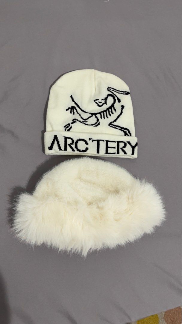 Arc'teryx Beanie and Furry Hat (Category: Luxury Accessories) located in Pasig City. Submitted by _missdee (Listing ID 1435424665, Image 1). Description: Listing includes an Arc'teryx beanie and a fluffy scarf. The beanie is white with a black Arc'teryx logo and lettering..