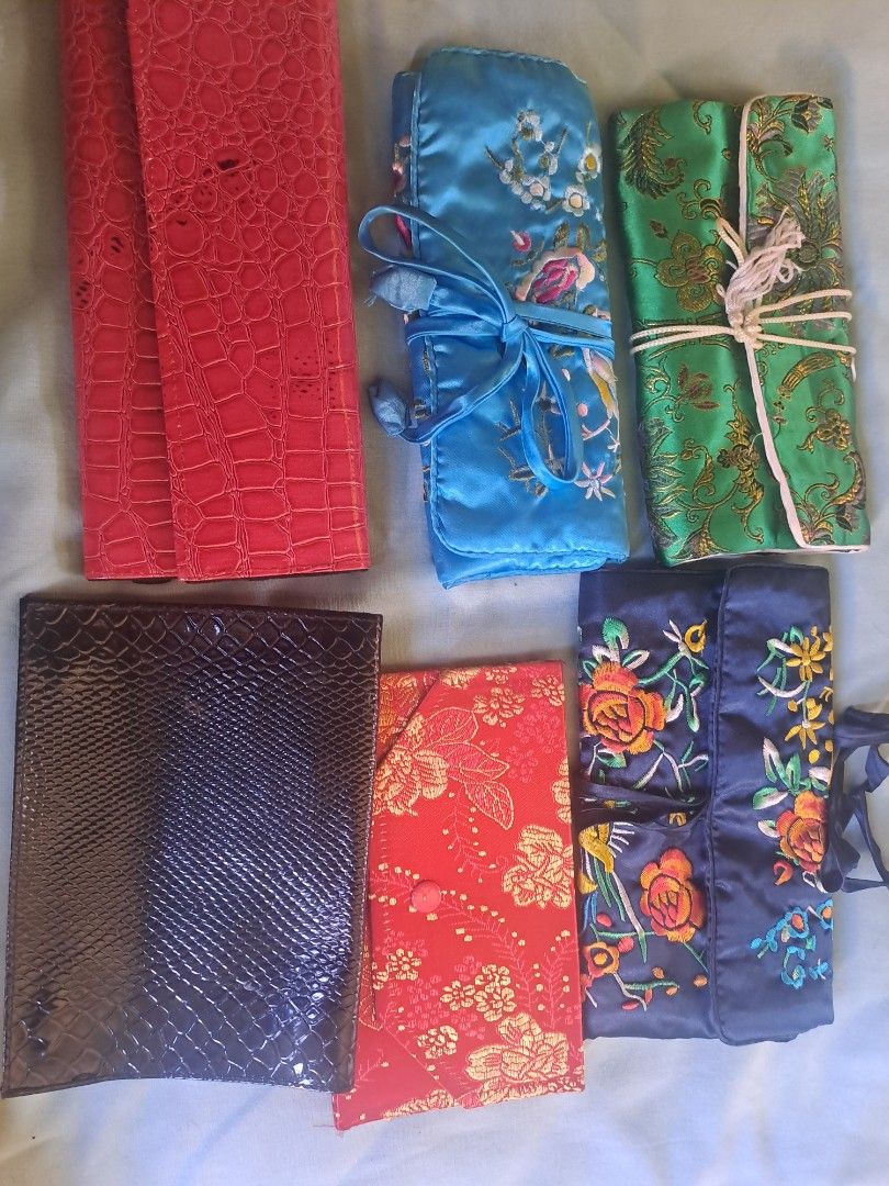 Assorted Jewelry Travel Cases (Category: Accessory Holder, Box & Organizers) located in Manila. Submitted by maggie54145 (Listing ID 1435522072, Image 1). Description: All items 350php Only - Jewelry travel cases - Available in various colors and designs - Features multiple compartments - Includes zippered pockets and snap closures - Some cases with embroidered floral patterns - Others with textured or solid finishes - Ideal for organizing and pr