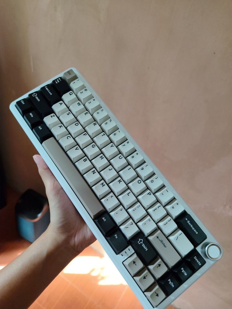Attack Shark X66 66-Key Mechanical Keyboard (Category: Computer Keyboard) located in Taguig. Submitted by sullestaroyce28 (Listing ID 1435342139, Image 3). Description: - Attack Shark X66 Mechanical Keyboard - 66-key layout - Connectivity: 2.4G, Bluetooth, and Wired - RGB Lighting - Gasket structure - Mechanical switches - White case with silver knob - Keycaps: White, black, and beige mix - Includes original box For sale attack shark x66 wireless