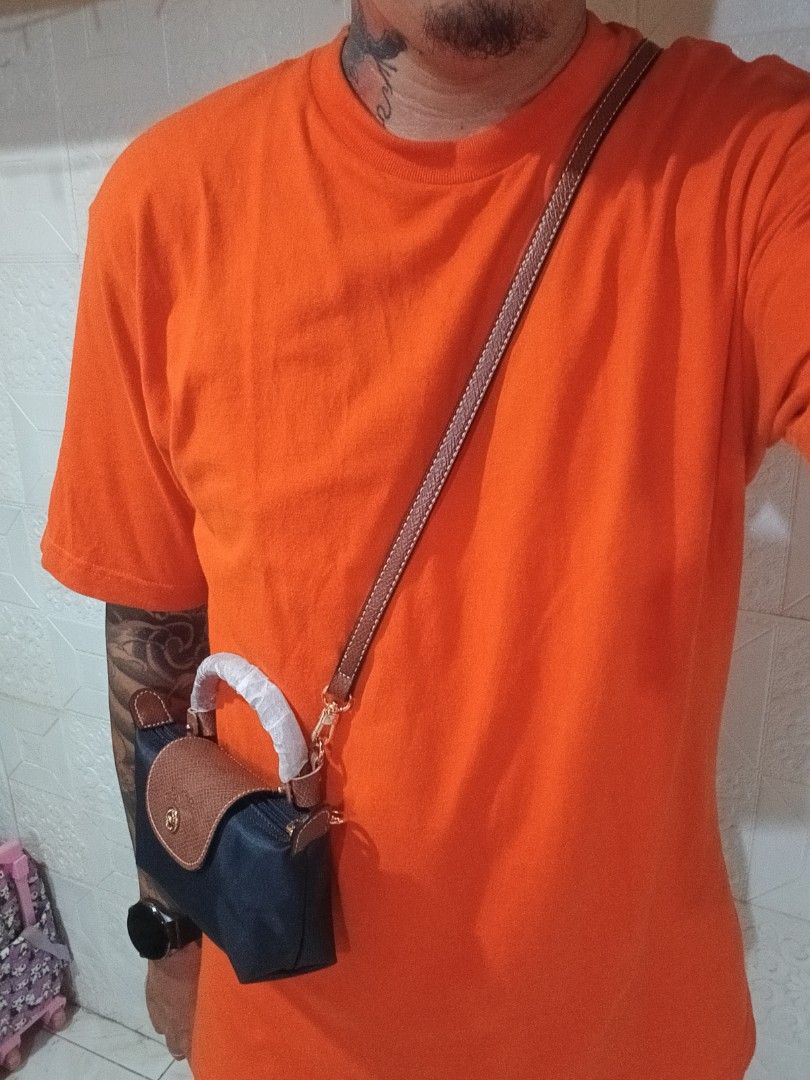 Authentic/Legit 💯 Longchamp Le Pliage Mini Sling Bag (Category: Luxury Bags & Wallets) located in Manila. Submitted by archie_doroy (Listing ID 1435374575, Image 2). Description: Authentic/Legit 💯 Longchamp Le Pliage Mini Sling Bag Unisex bagay din sa lalaki Made in France Brand new 💯 Kasya Cellphone at Long wallet Retail price 7500 Selling 2500+sf only.