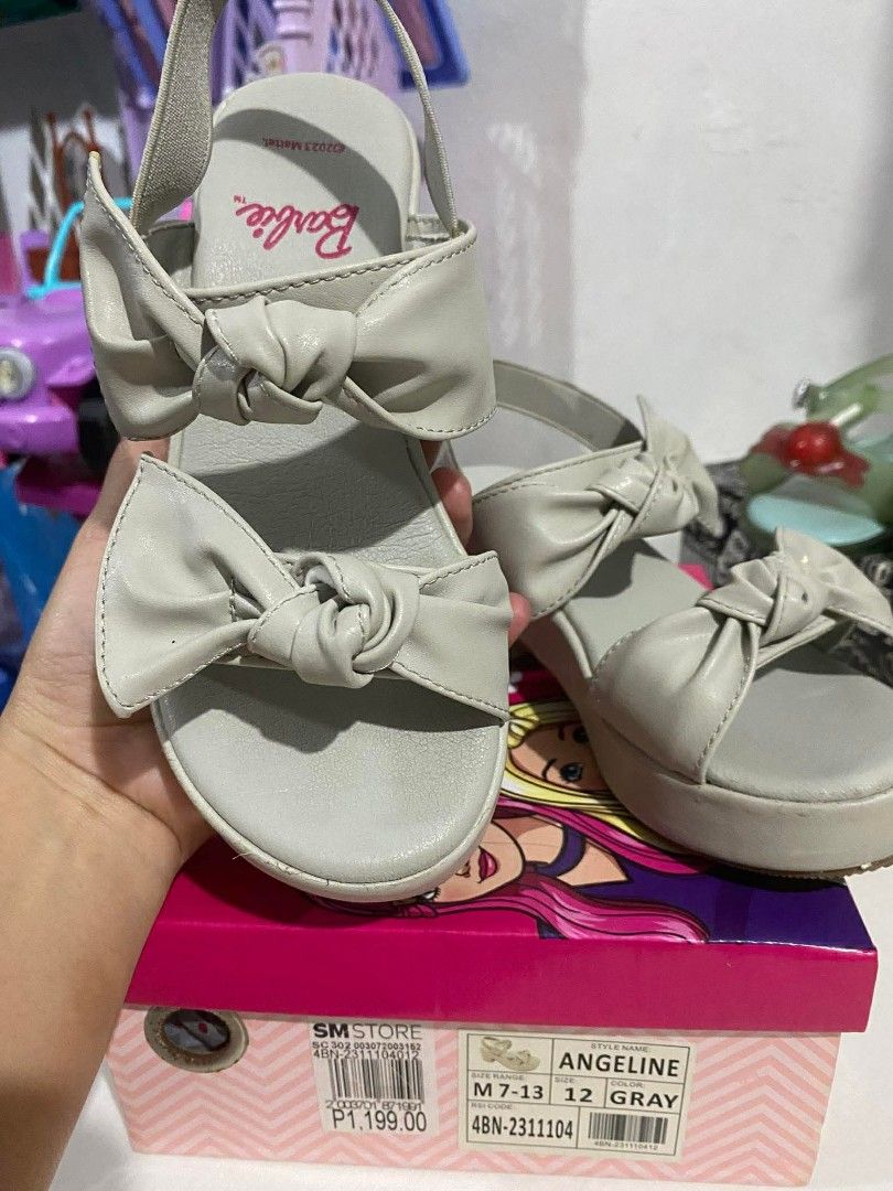 Barbie Angeline Sandals Gray Size 12 (Category: Babies & Kids Fashion) located in Taguig. Submitted by wolffangs (Listing ID 1435345725, Image 1). Description: Barbie Angeline sandals in gray preloved barely used - Size 12 - Features a bow detail - Platform heel - Includes original box.