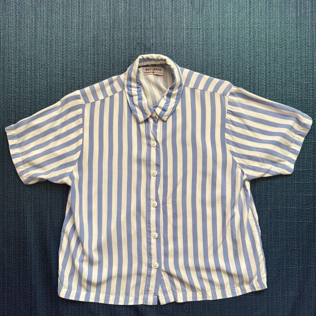 BNY Jeans Striped Shirt Blouse (Category: Blouses) located in Mandaluyong City. Submitted by adrenalin01 (Listing ID 1435405468, Image 2). Description: - BNY Jeans shirt - Blue and white stripes - Collared neckline - Short sleeves - Button-down closure (with complete buttons) - No stains - Washed already - Use once during an event - RFS: decluttering.