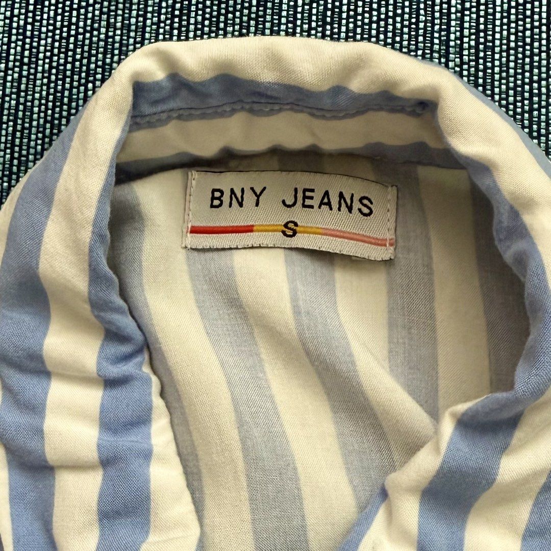 BNY Jeans Striped Shirt Blouse (Category: Blouses) located in Mandaluyong City. Submitted by adrenalin01 (Listing ID 1435405468, Image 3). Description: - BNY Jeans shirt - Blue and white stripes - Collared neckline - Short sleeves - Button-down closure (with complete buttons) - No stains - Washed already - Use once during an event - RFS: decluttering.