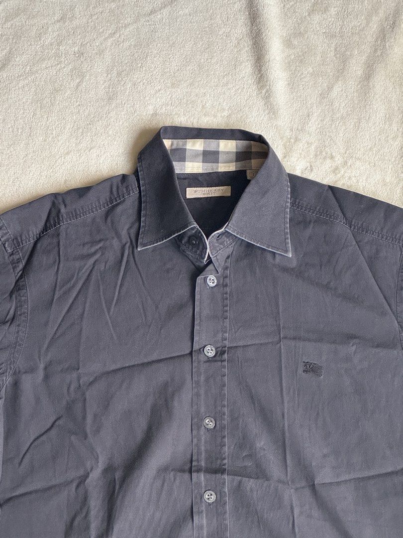 Burberry Long Sleeve Shirt (Category: Tshirts & Polo Shirts ) located in Manila. Submitted by ffranzledesma (Listing ID 1435496768, Image 2). Description: - Long-sleeved shirt - Button-down front - Features a collar - Small chest logo - Solid dark color - Tailored fit - Versatile for various occasions Description: size L, worn once Dimes: L - 28 in W - 19.5 in MOP: Gcash or Maya MOD: Lalamove or J&T.