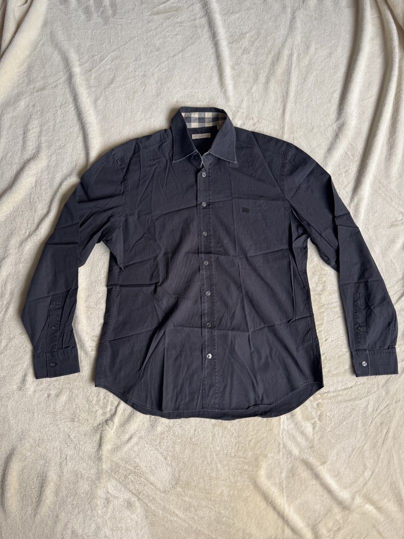 Burberry Long Sleeve Shirt (Category: Tshirts & Polo Shirts ) located in Manila. Submitted by ffranzledesma (Listing ID 1435496768, Image 1). Description: - Long-sleeved shirt - Button-down front - Features a collar - Small chest logo - Solid dark color - Tailored fit - Versatile for various occasions Description: size L, worn once Dimes: L - 28 in W - 19.5 in MOP: Gcash or Maya MOD: Lalamove or J&T.
