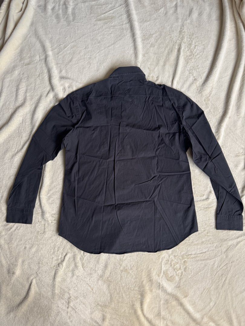 Burberry Long Sleeve Shirt (Category: Tshirts & Polo Shirts ) located in Manila. Submitted by ffranzledesma (Listing ID 1435496768, Image 3). Description: - Long-sleeved shirt - Button-down front - Features a collar - Small chest logo - Solid dark color - Tailored fit - Versatile for various occasions Description: size L, worn once Dimes: L - 28 in W - 19.5 in MOP: Gcash or Maya MOD: Lalamove or J&T.