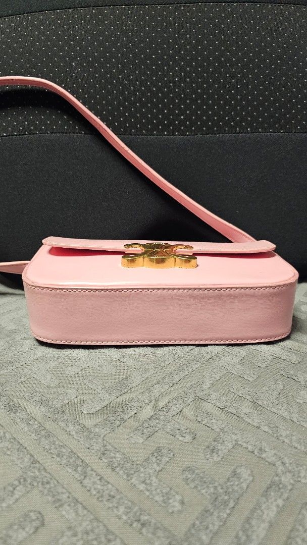 Celine Triomphe Claude shoulder bag (Category: Luxury Bags & Wallets) located in Quezon City. Submitted by jollythrift (Listing ID 1435351655, Image 3). Description: CELINE TRIOMPHE SHOULDER BAG Color: Rose Pink Material: shiny calfskin, sheep leather lining -Measurements : 20 x 10 x 4 cm (length x height x depth) -Triomphe metal texture - lock buckle -Inner flat pocket -Adjustable leather shoulder strap length 20 cm -NGA.