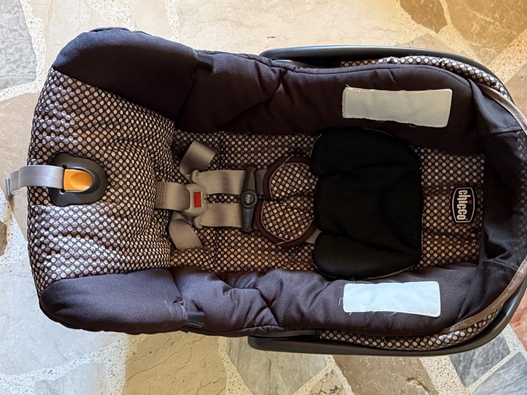 Chicco KeyFit 30 Infant Car Seat (Category: Car Seats) located in Calamba. Submitted by mokissm226349 (Listing ID 1435358876, Image 2). Description: Chicco KeyFit 30 infant car seat features a black and patterned fabric design. It includes a headrest, harness straps, and a base. The seat has a handle for carrying and a sunshade. The Chicco logo is visible on the side..