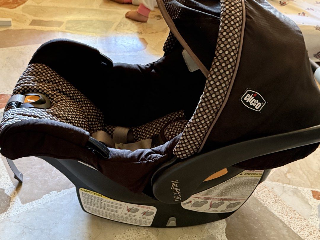 Chicco KeyFit 30 Infant Car Seat (Category: Car Seats) located in Calamba. Submitted by mokissm226349 (Listing ID 1435358876, Image 3). Description: Chicco KeyFit 30 infant car seat features a black and patterned fabric design. It includes a headrest, harness straps, and a base. The seat has a handle for carrying and a sunshade. The Chicco logo is visible on the side..